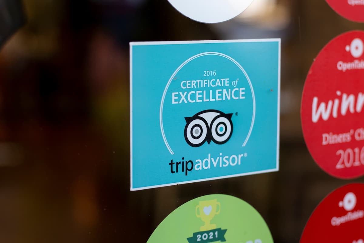 Etiqueta de vinil de TripAdvisor, fabricada en punto-clave